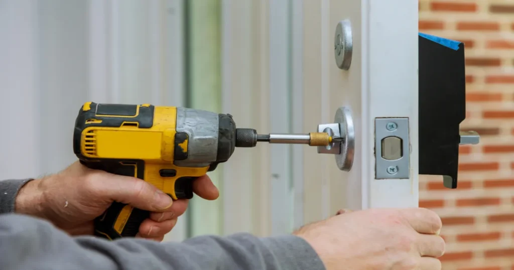 Locksmith installing a smart lock on a front door