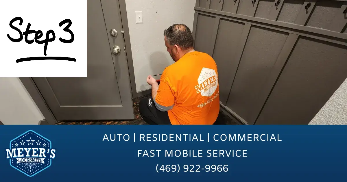 A locksmith in Allen replacing a door lock