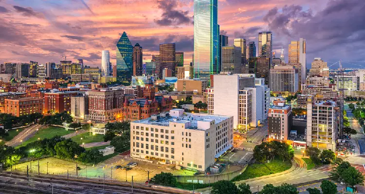 DFW skyline at sunset representing the businesses we protect across the Metroplex.