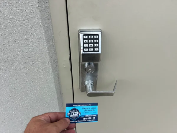 Commercial keypad lever lock installed on a steel office door