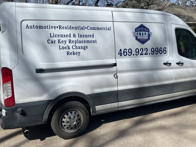Marked Meyer's Local Locksmith van listing car key replacement, lock change and rekey services